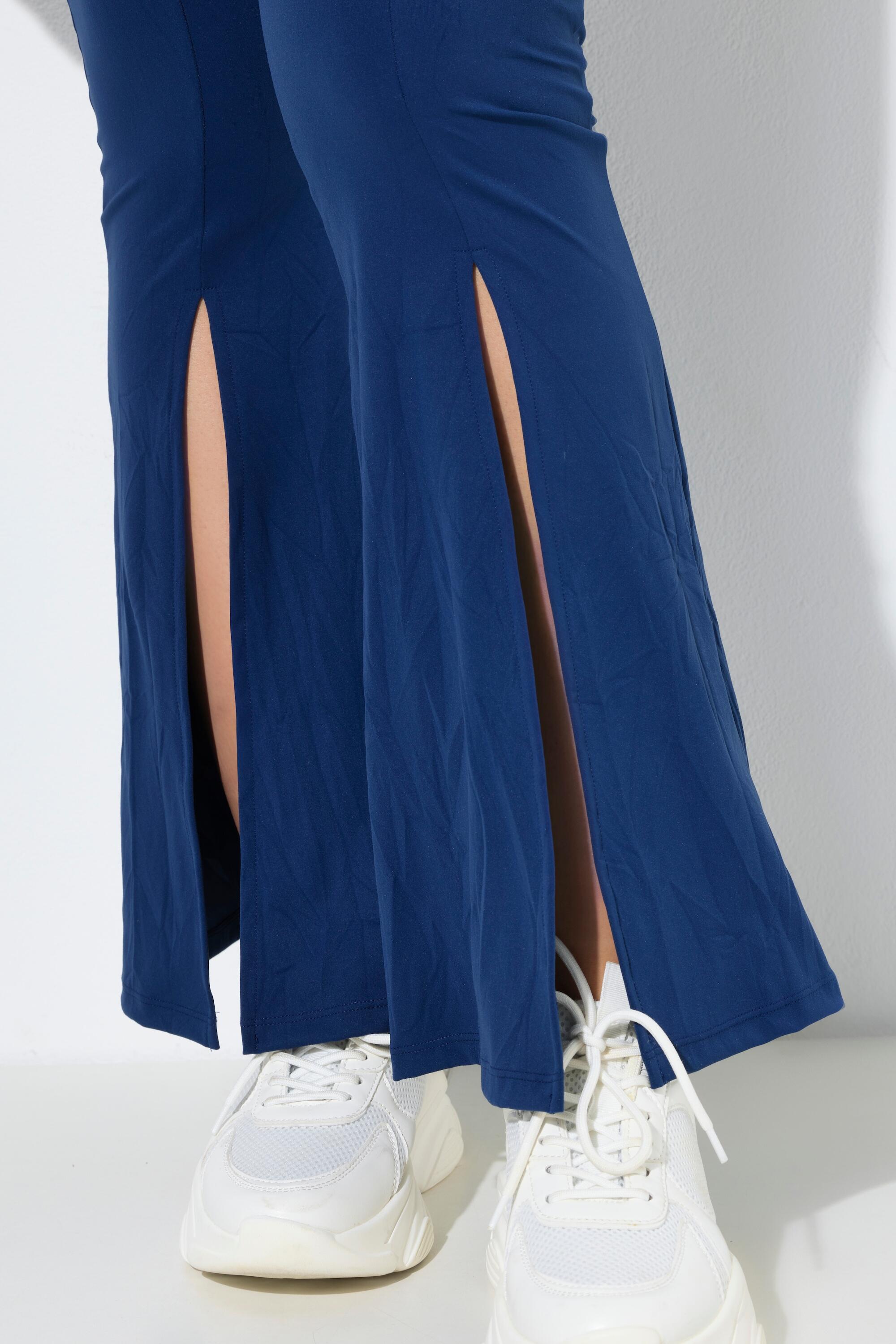 Femme Legging technique bas de jambe évasée et poche zippée 3/6