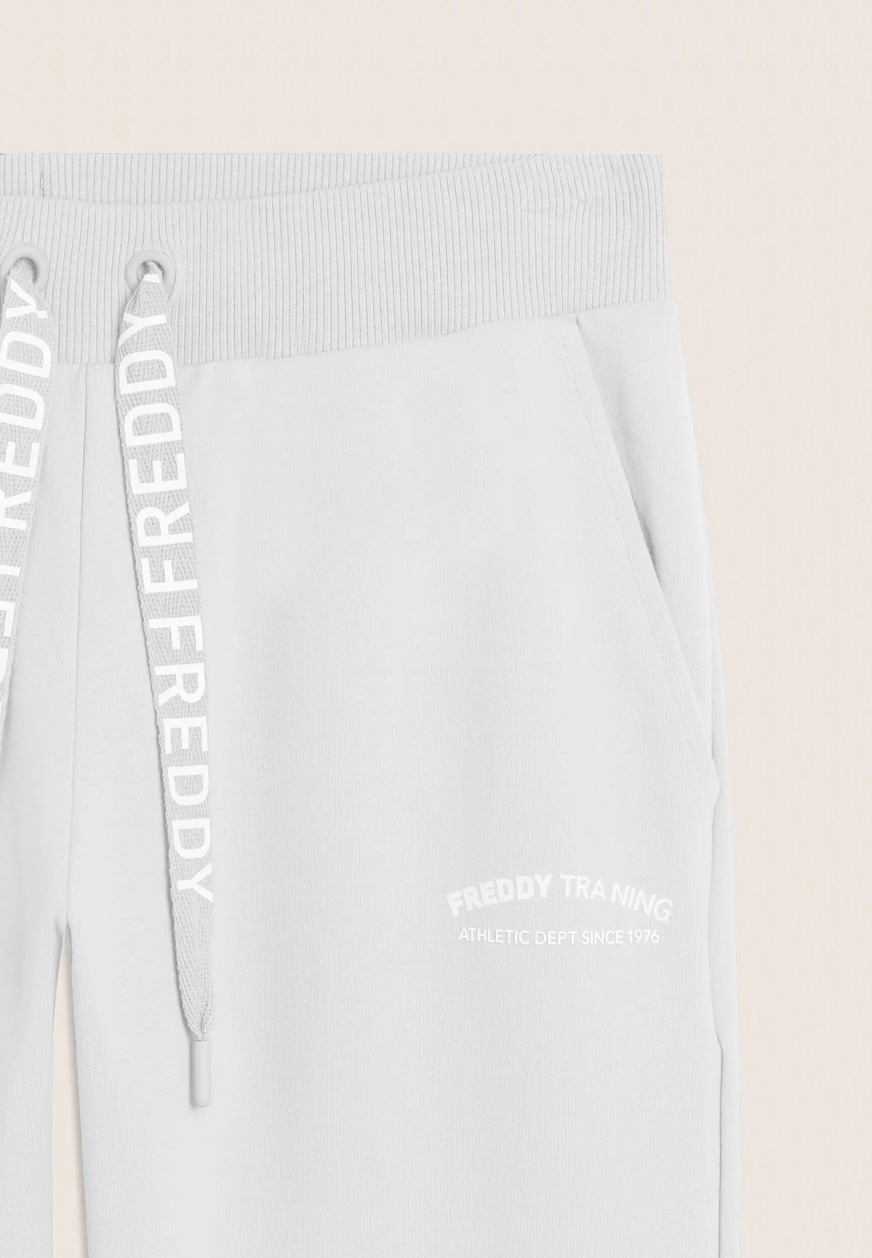 Pantalón 7/8 con aberturas laterales en los bajos y logotipo FREDDY 3/3