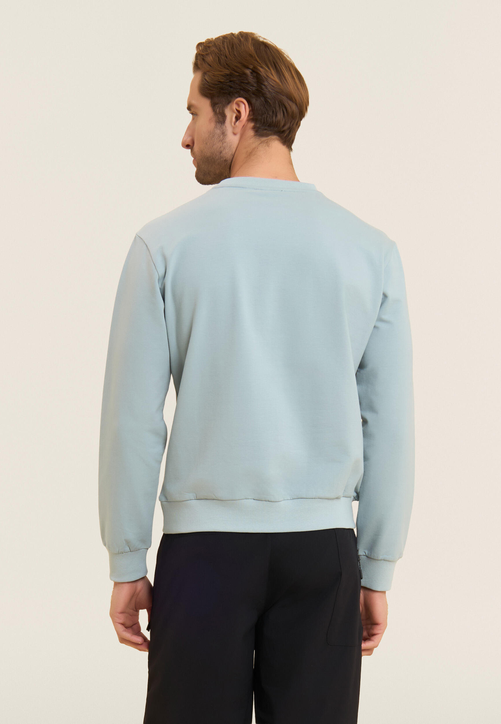 Felpa girocollo in baby french terry con taschino zip 3/4