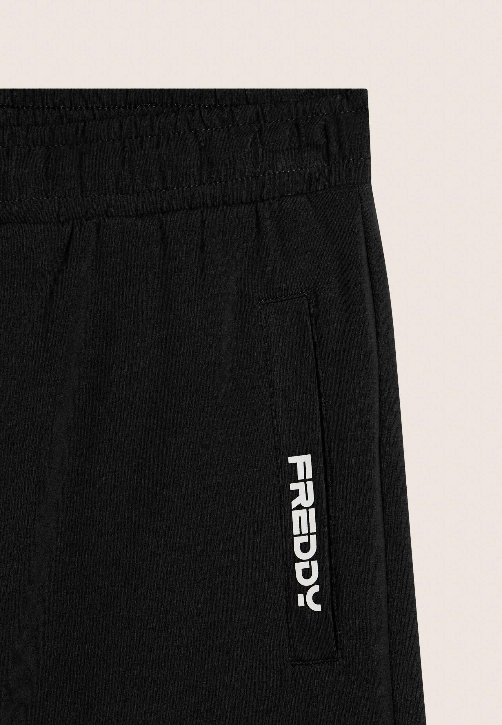 Pantalon court en jersey élastique avec poche 3/3