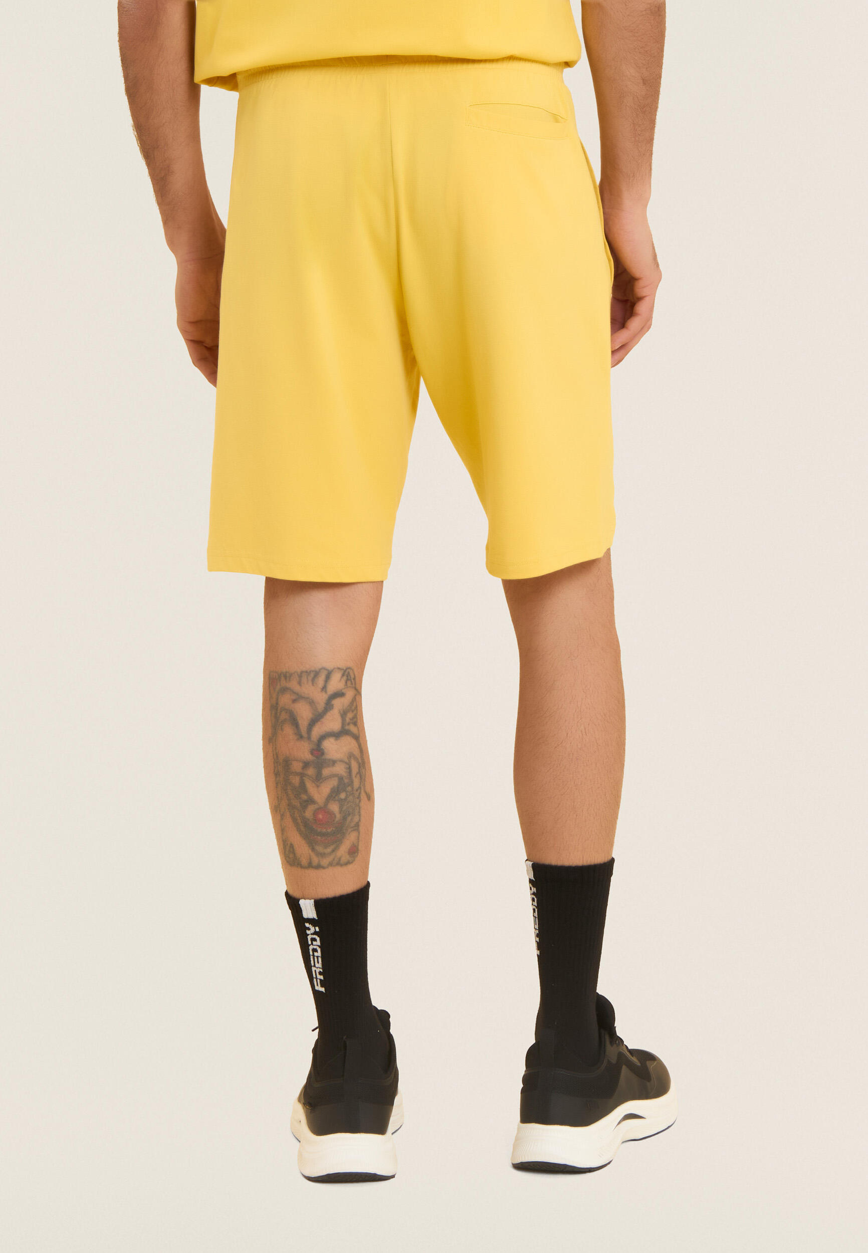 Pantalon court en jersey élastique avec poche 3/4