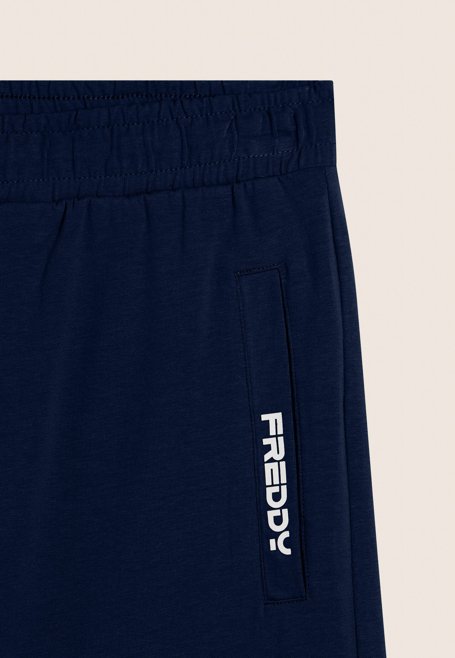 Pantalon court en jersey élastique avec poche 3/3