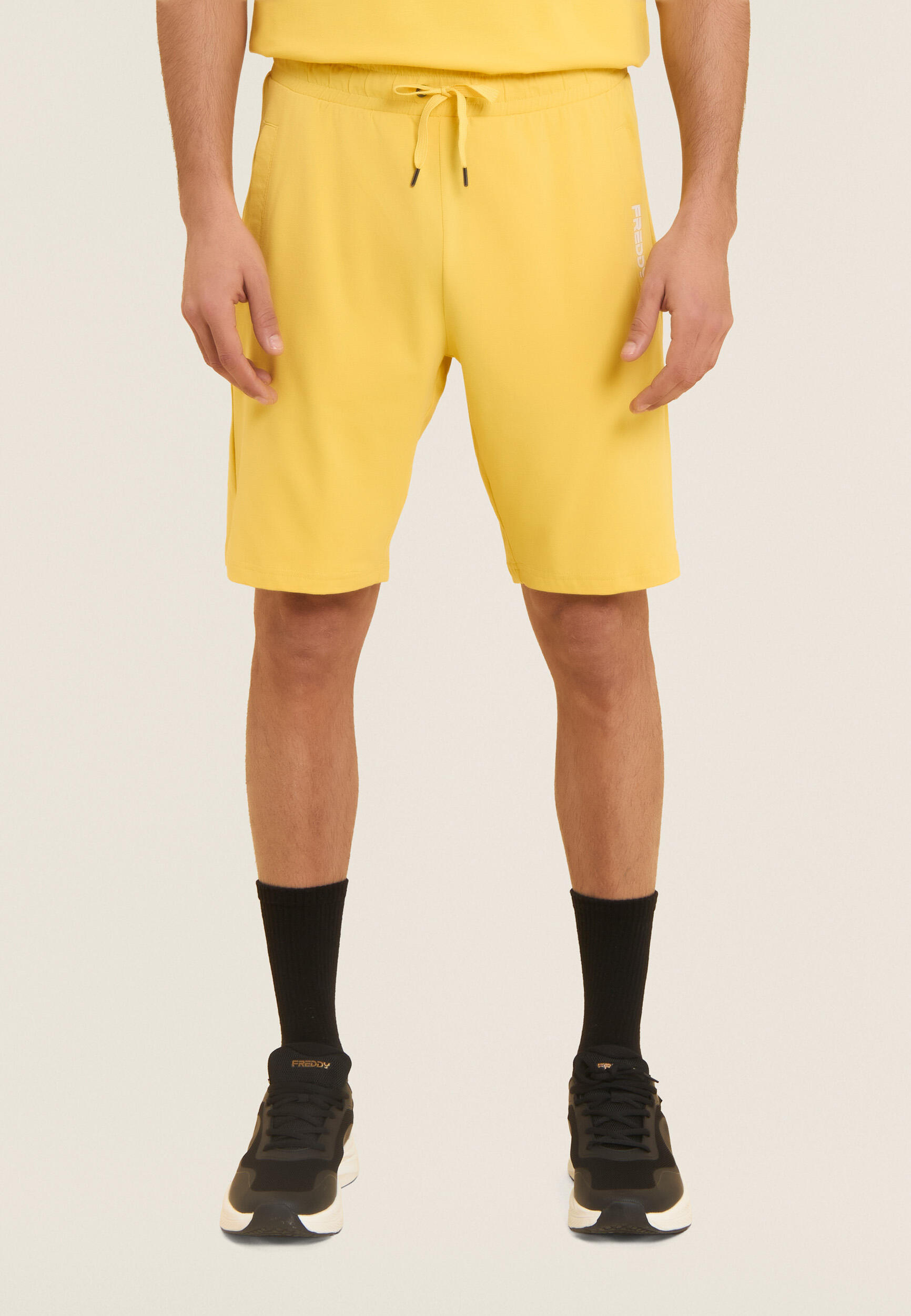 Pantalon court en jersey élastique avec poche 2/4