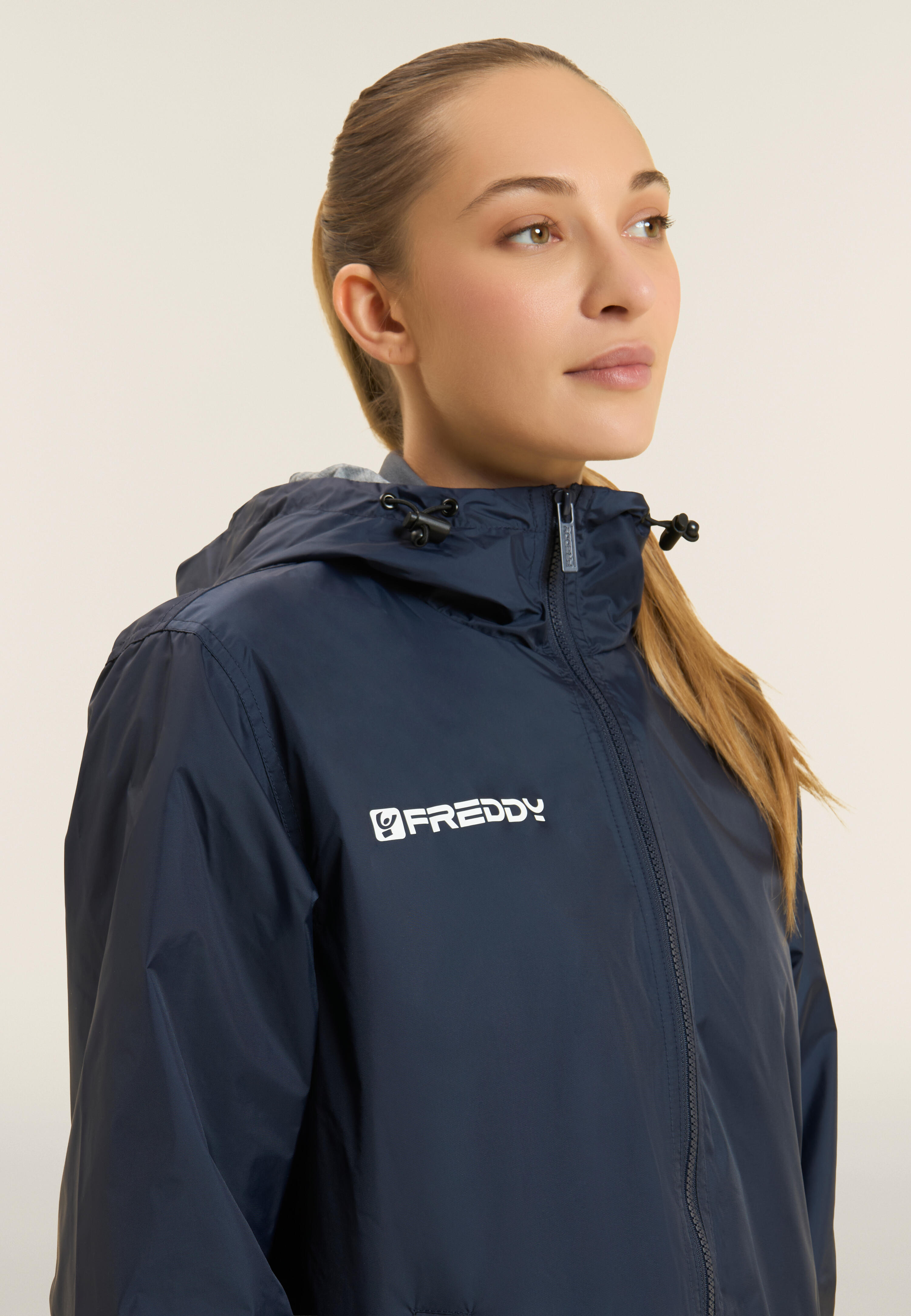 Giacca impermeabile Unisex con cappuccio regolabile e zip 4/4