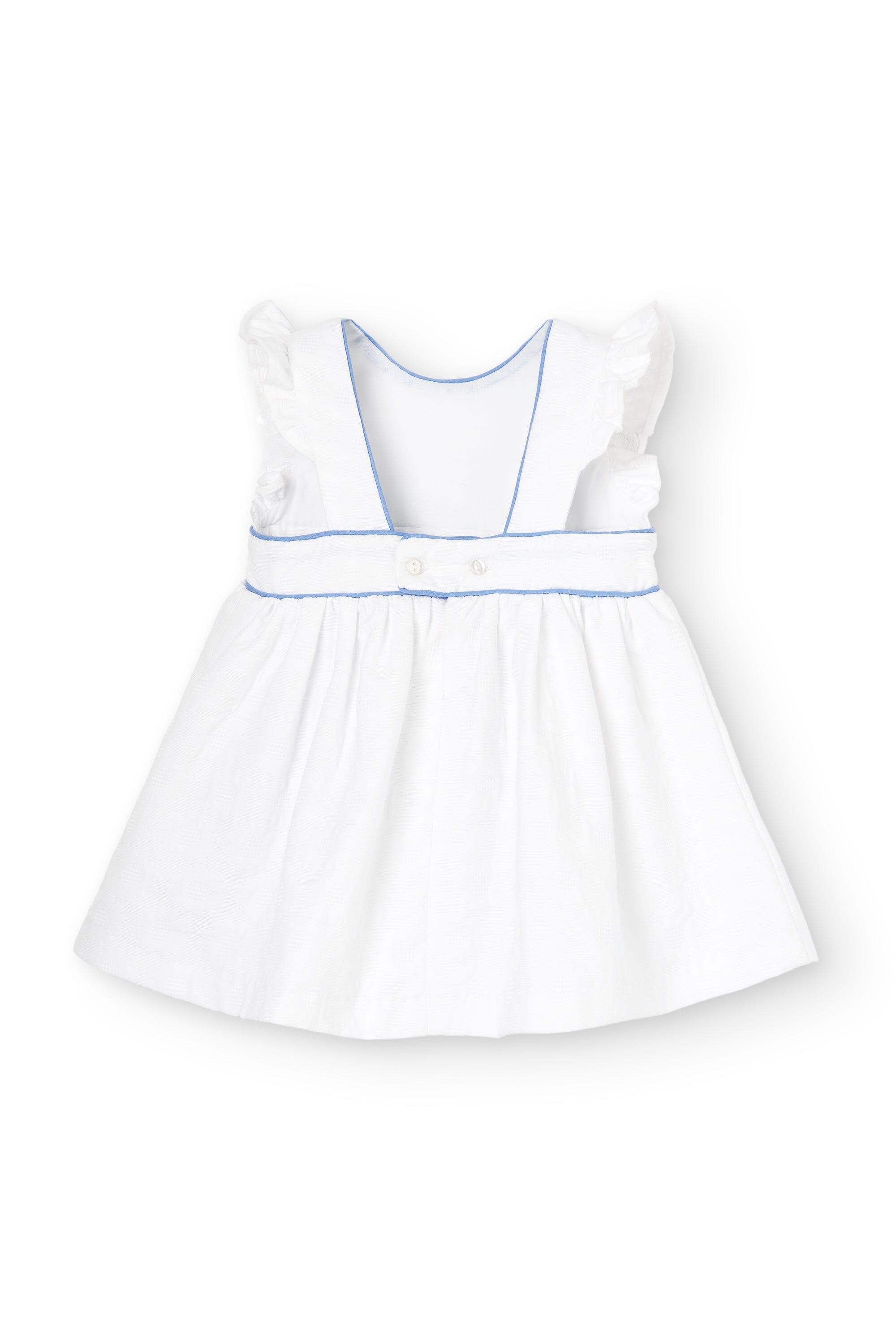 Vestido de bebé blanco con flores azules 3/5