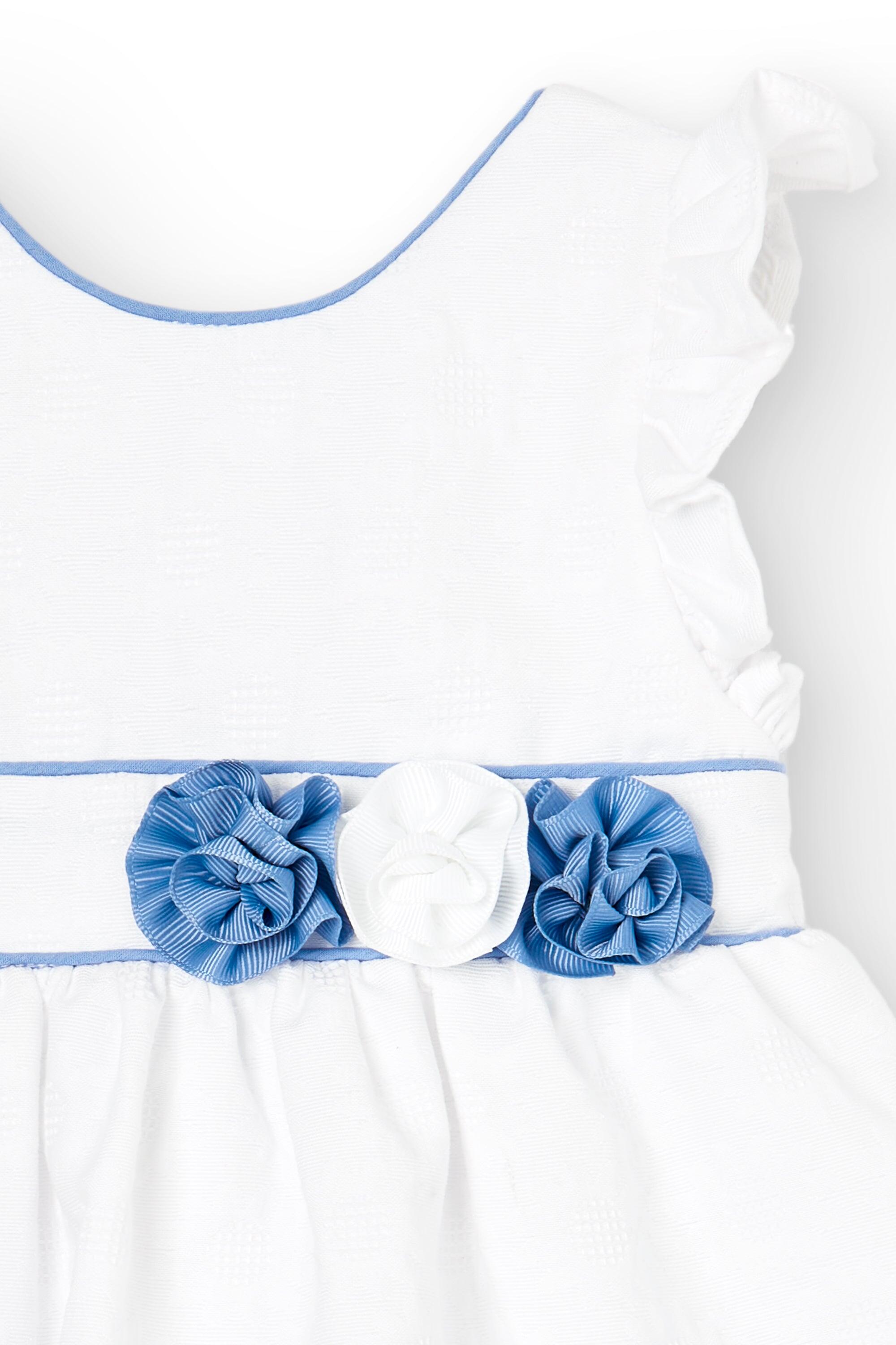 Vestido de bebé blanco con flores azules 2/5