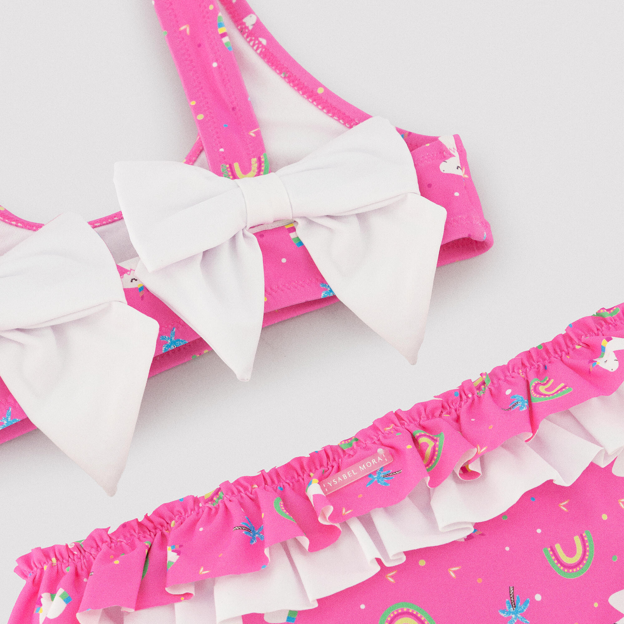 Bikini niña detalle volantes y lazos estampado unicornios rosa 3/7
