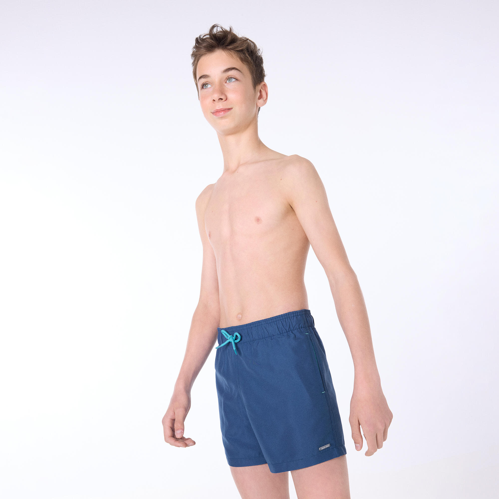 Bañador juvenil corto estampado liso azul 3/4