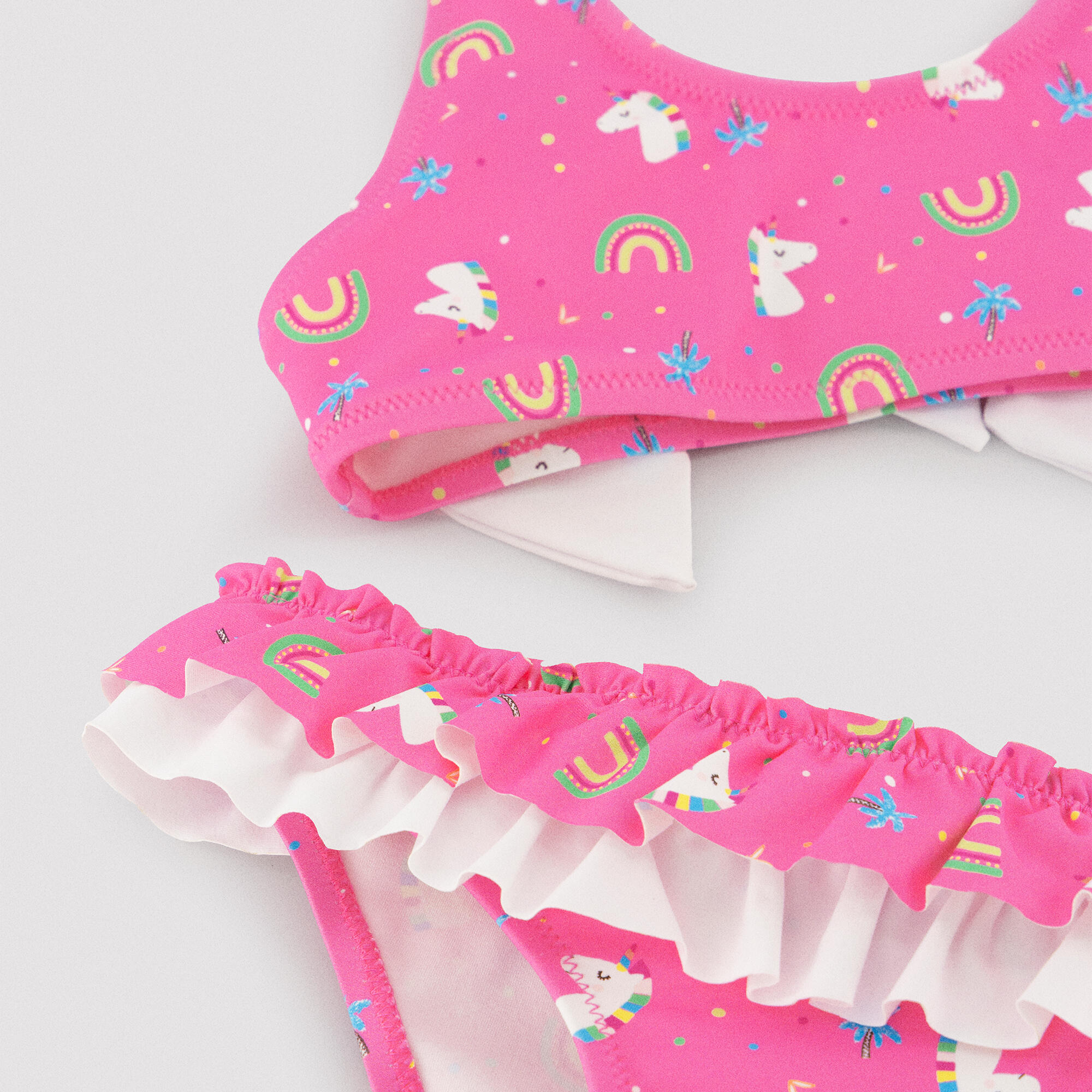 Bikini niña detalle volantes y lazos estampado unicornios rosa 2/7