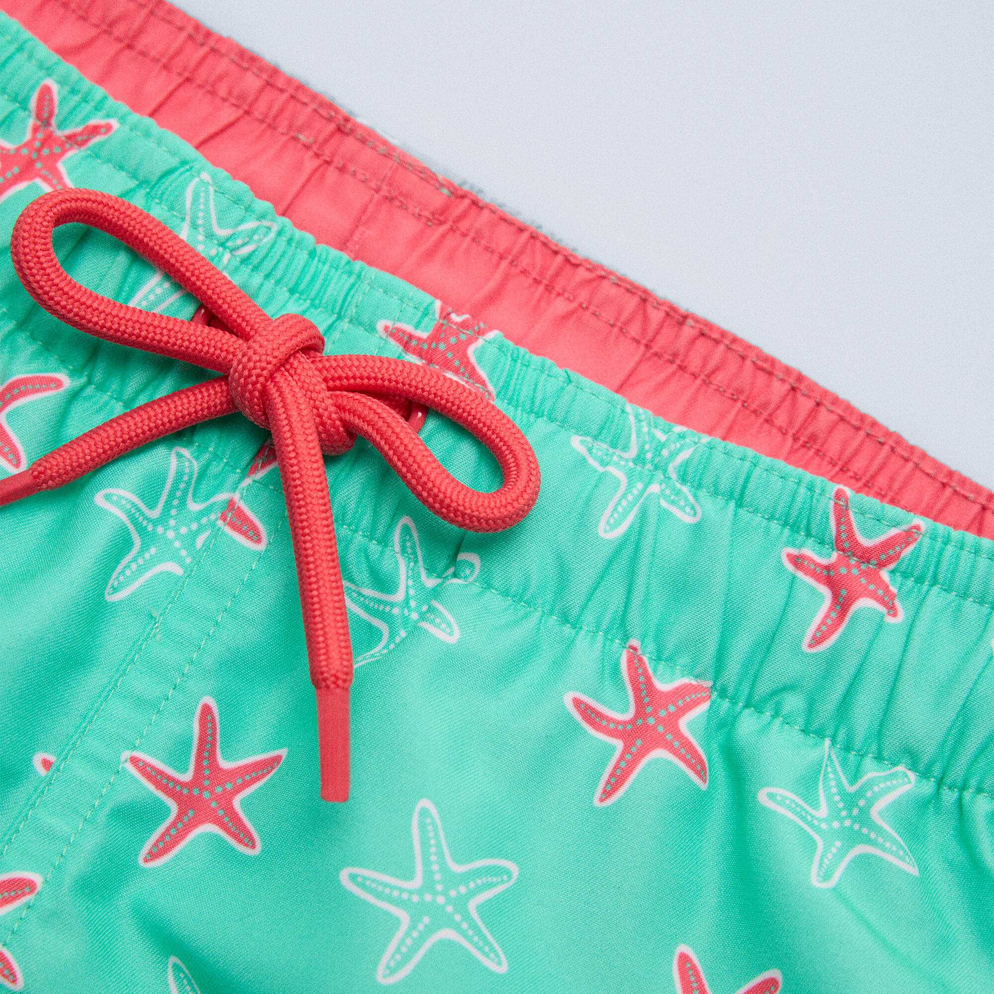 Bañdor niño corto estampado estrellas marinas turquesa 4/7