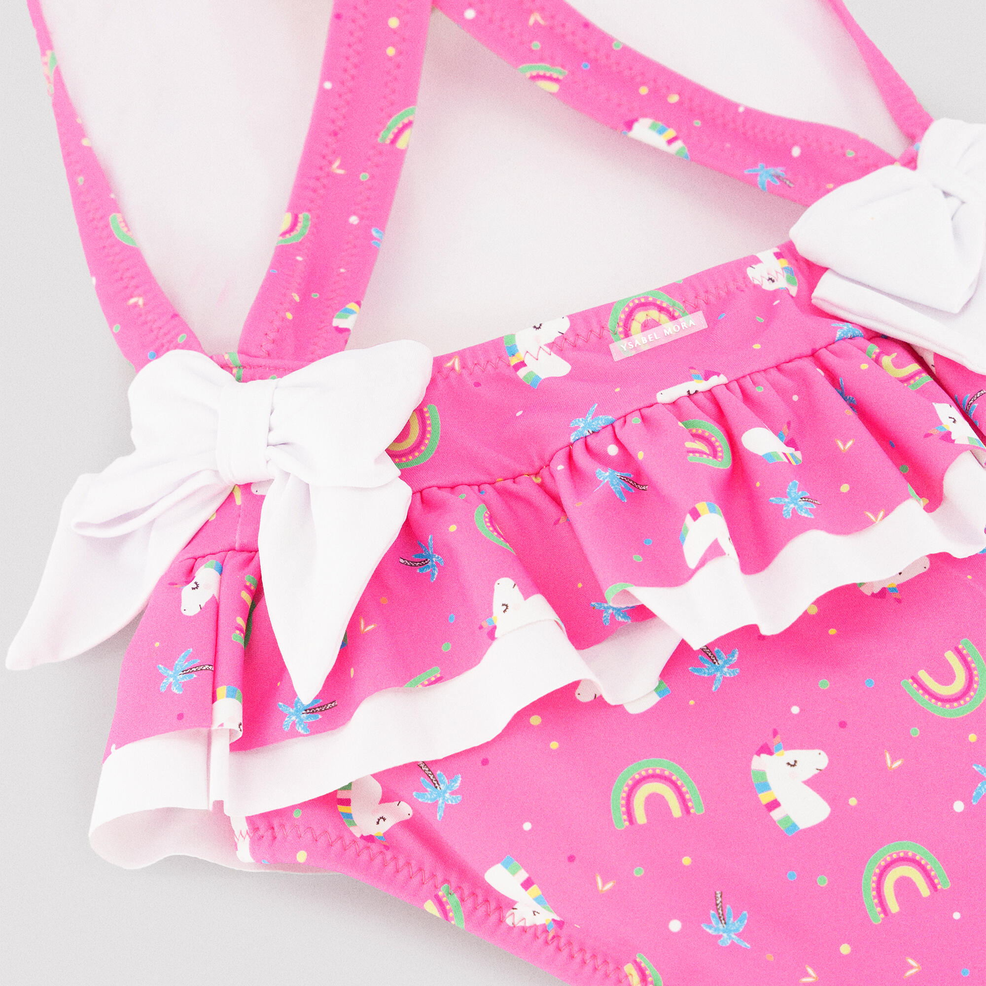 Bañador niña detalles volantes y lazos estampado unicornios rosa 3/5