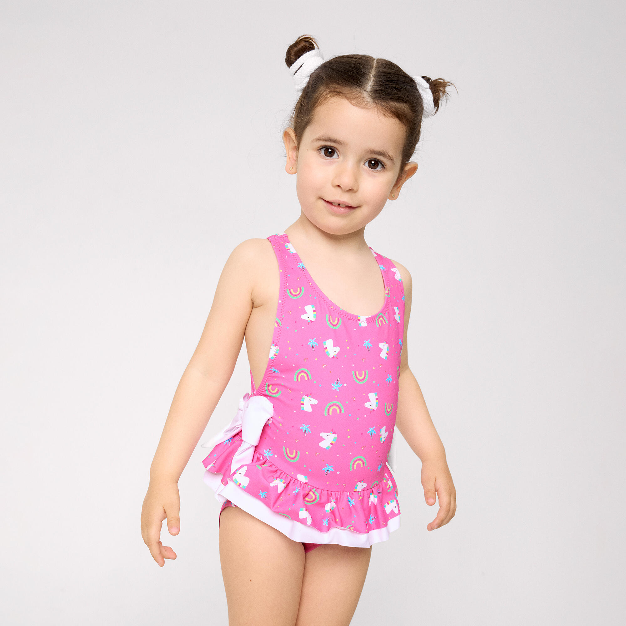 Bañador niña detalles volantes y lazos estampado unicornios rosa 4/5