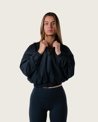 Veste de survêtement femme courte tissée zippée fitness streetwear – noir
