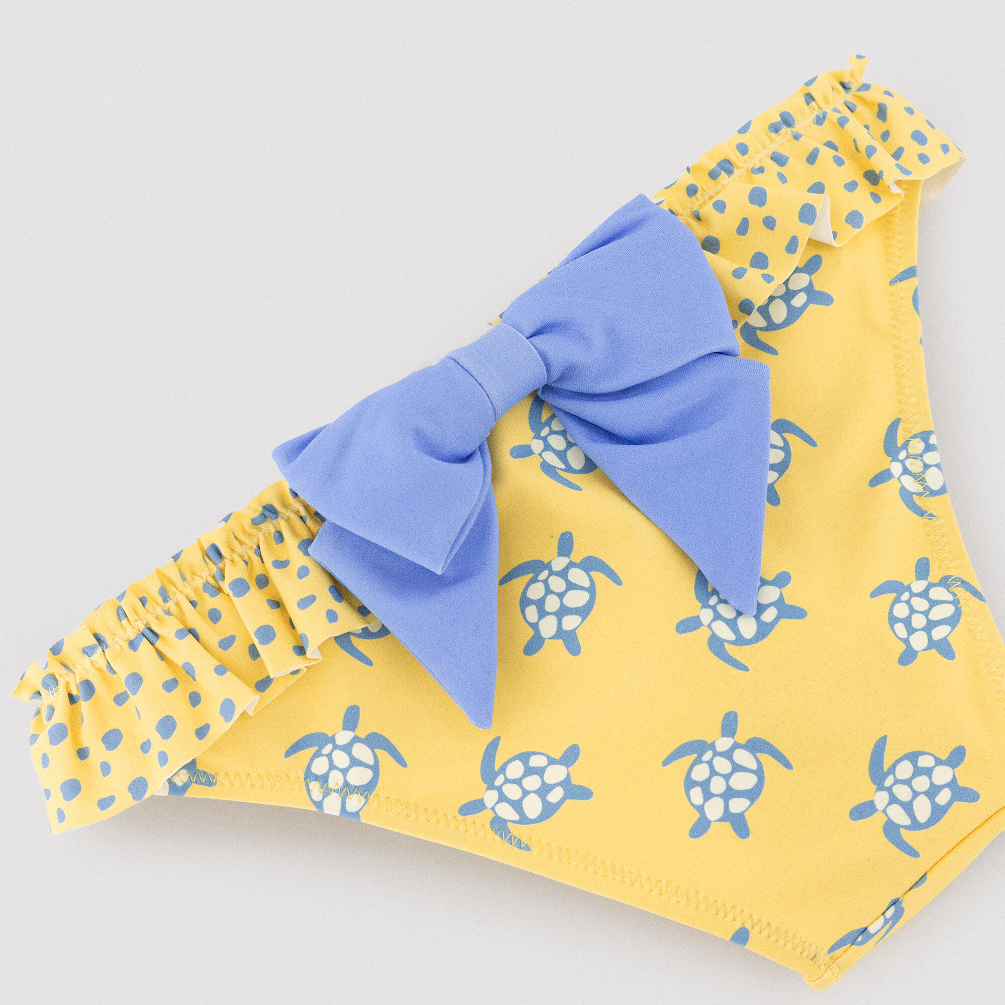 Culetín niña detalle volantes y lazos estampado tortugas amarillo 3/6