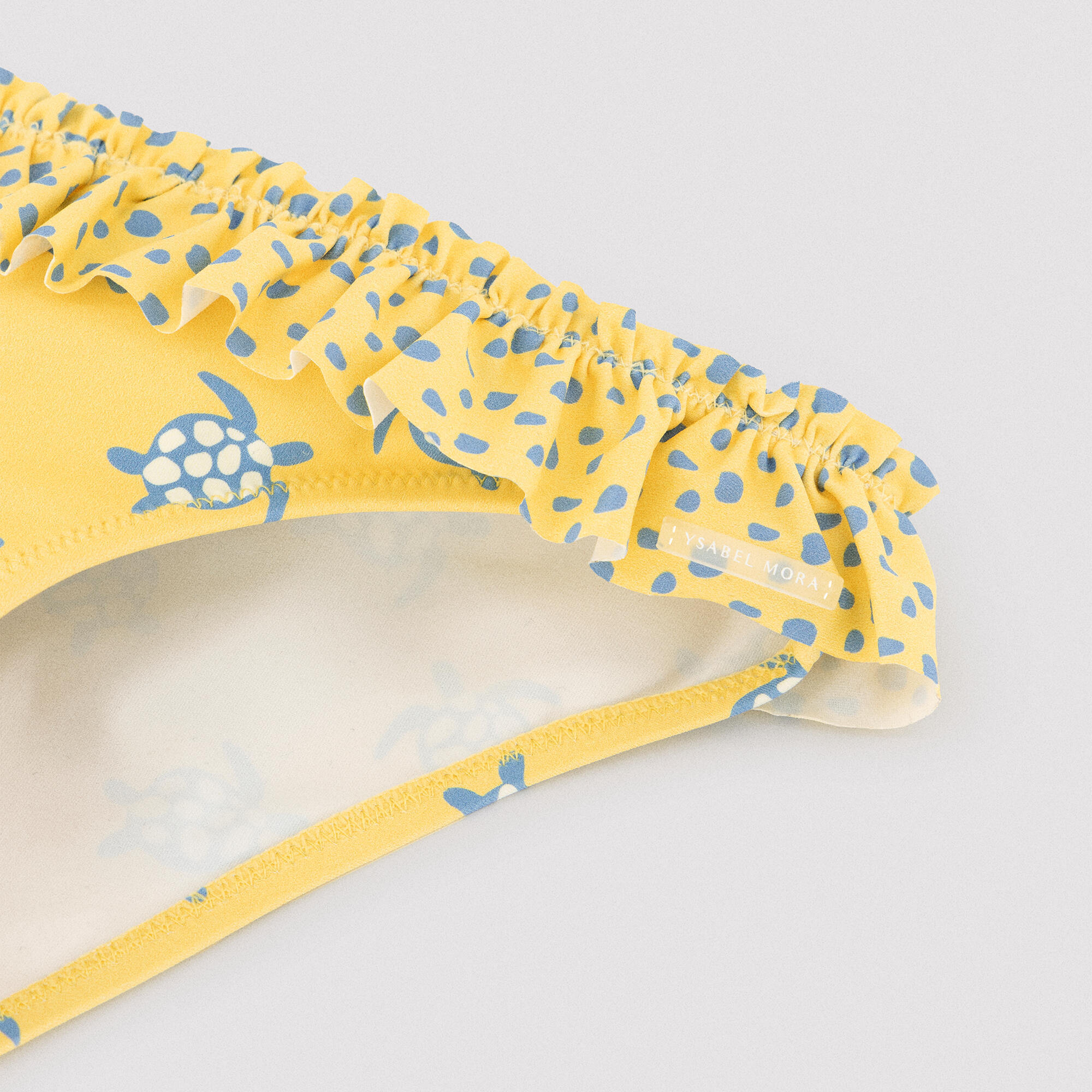 Culetín niña detalle volantes y lazos estampado tortugas amarillo 2/6
