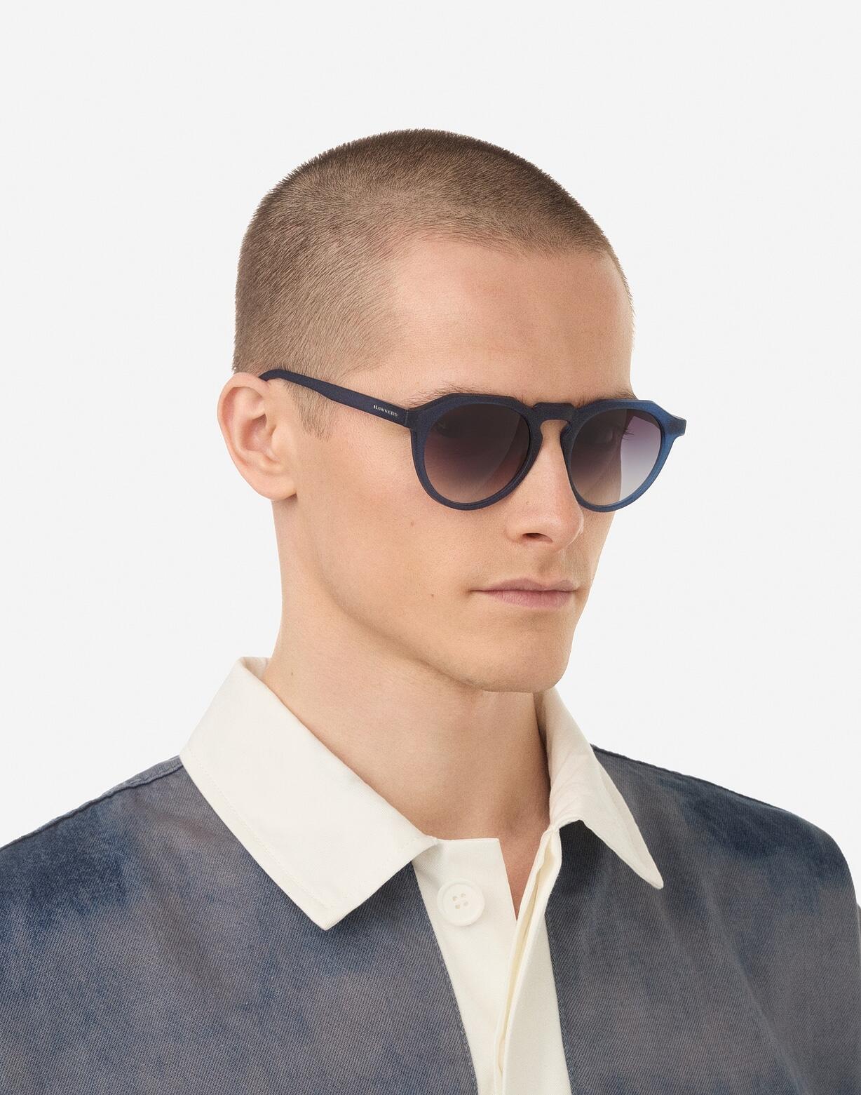 HAWKERS Zonnebrillen mannen en vrouwen NAVY TRANSPARENT IRON WARWICK RAW 7/8