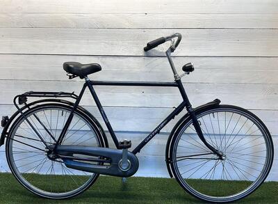 Gazelle stadsfiets (pre-owned), zwart - 28", met verlichting en standaard.