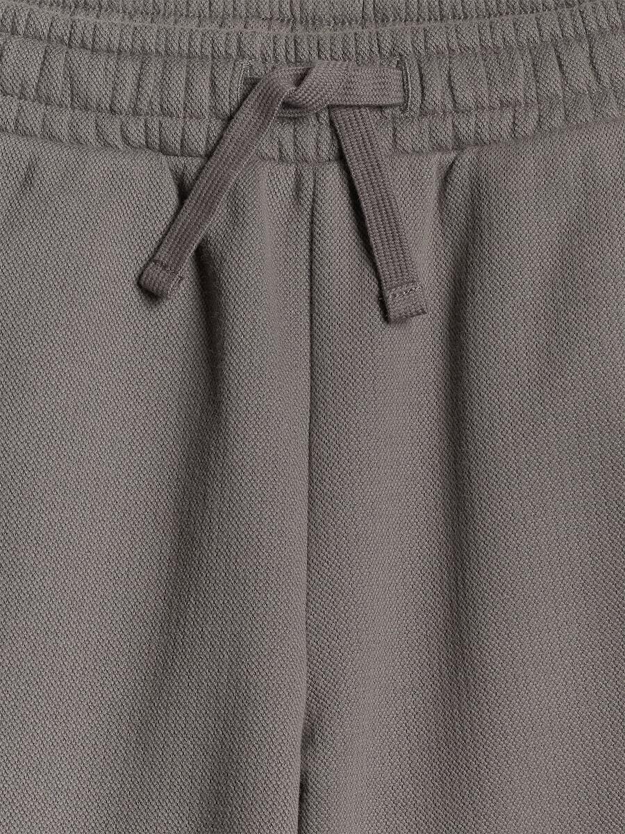 Spodnie dresowe ze strukturalnej dzianiny chłopięce 4F 4FJRSS26TTROM1921 5/7