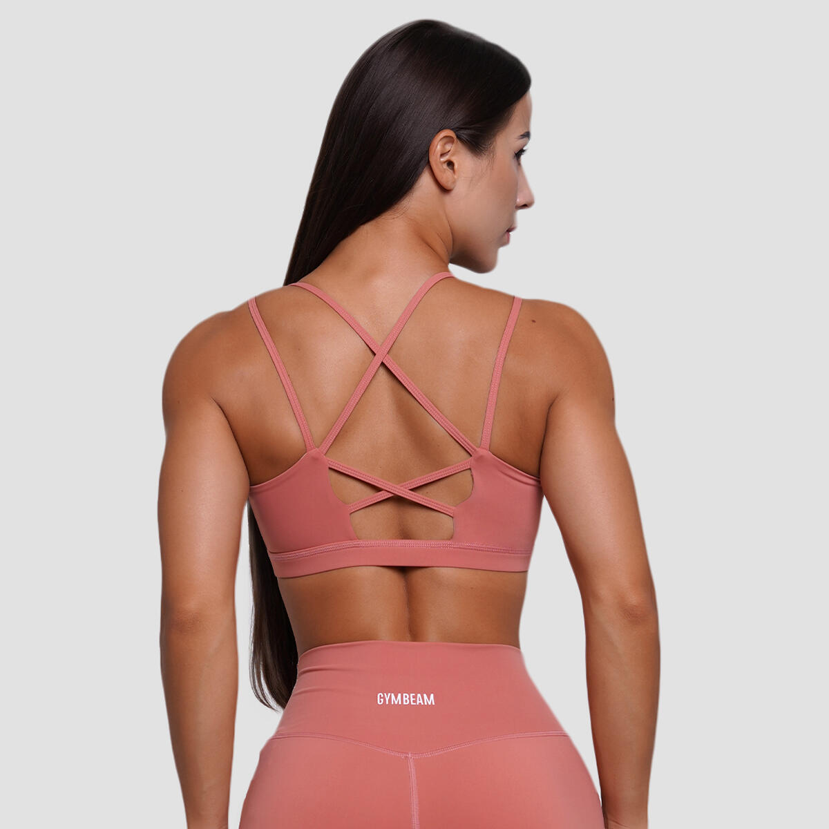 Biustonosz sportowy damski fitness bez zapięcia łososiowy FIT 3/7