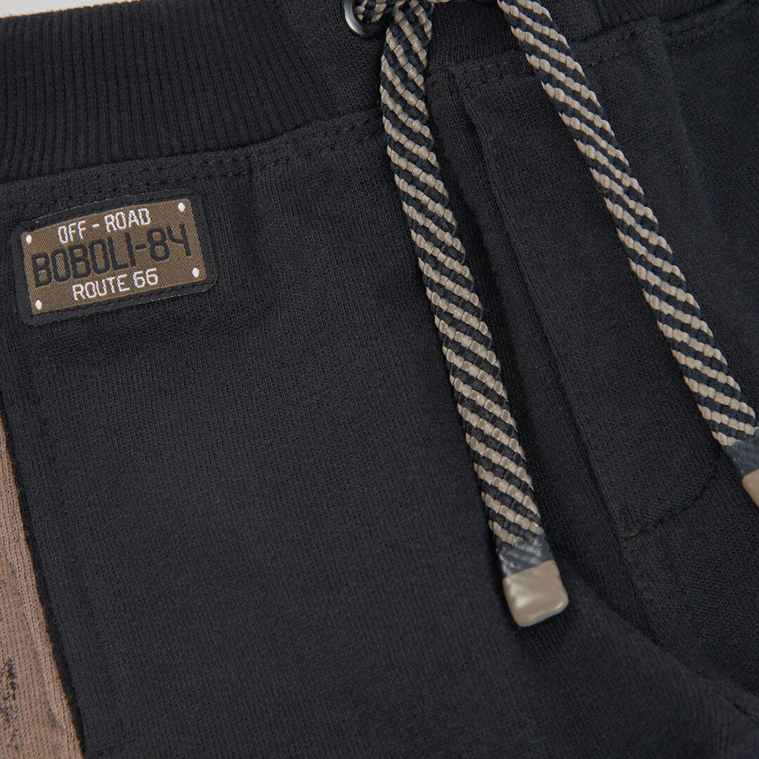 Pantalón felpa niño negro con franjas laterales 3/4