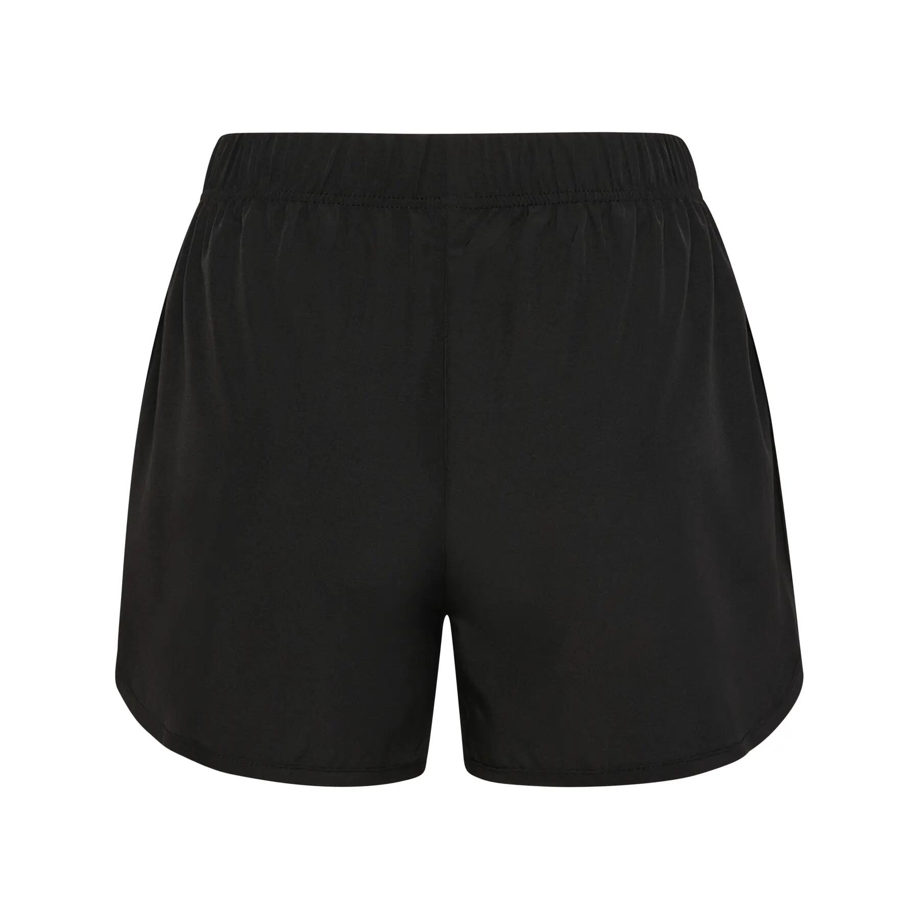 Saia curta com barra curva para mulher Hummel 3/4