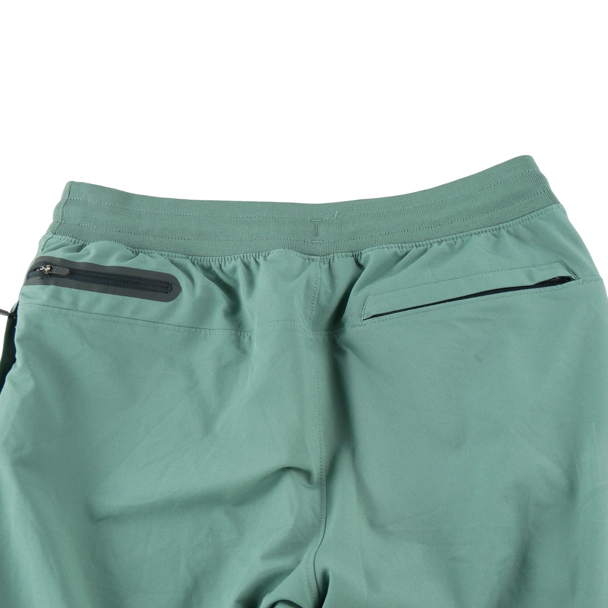 Calça de treino masculina Under Armour ajustada verde 4/7