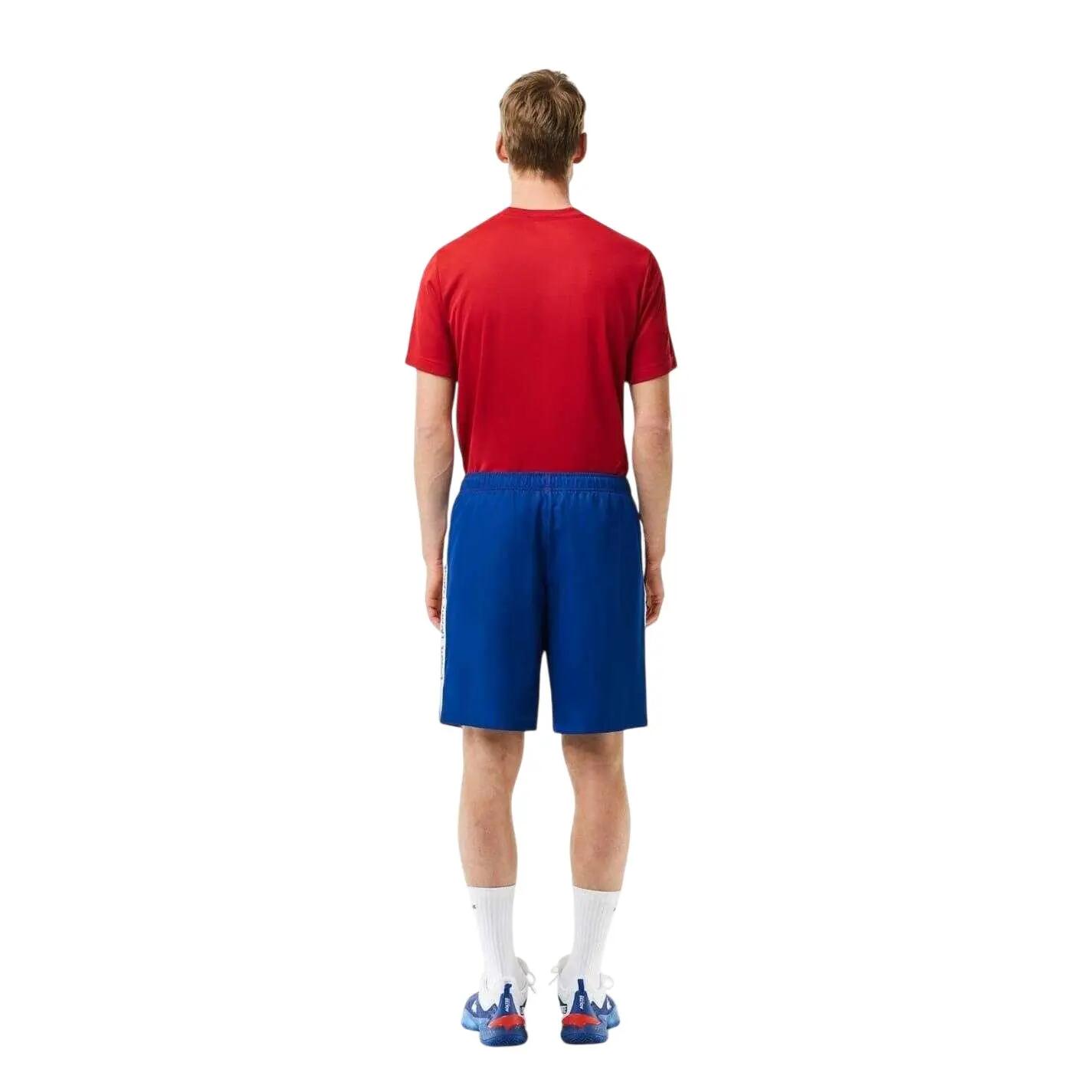 Shorts für , Tennis Herren Orange/Blauer Kapitän 2/4