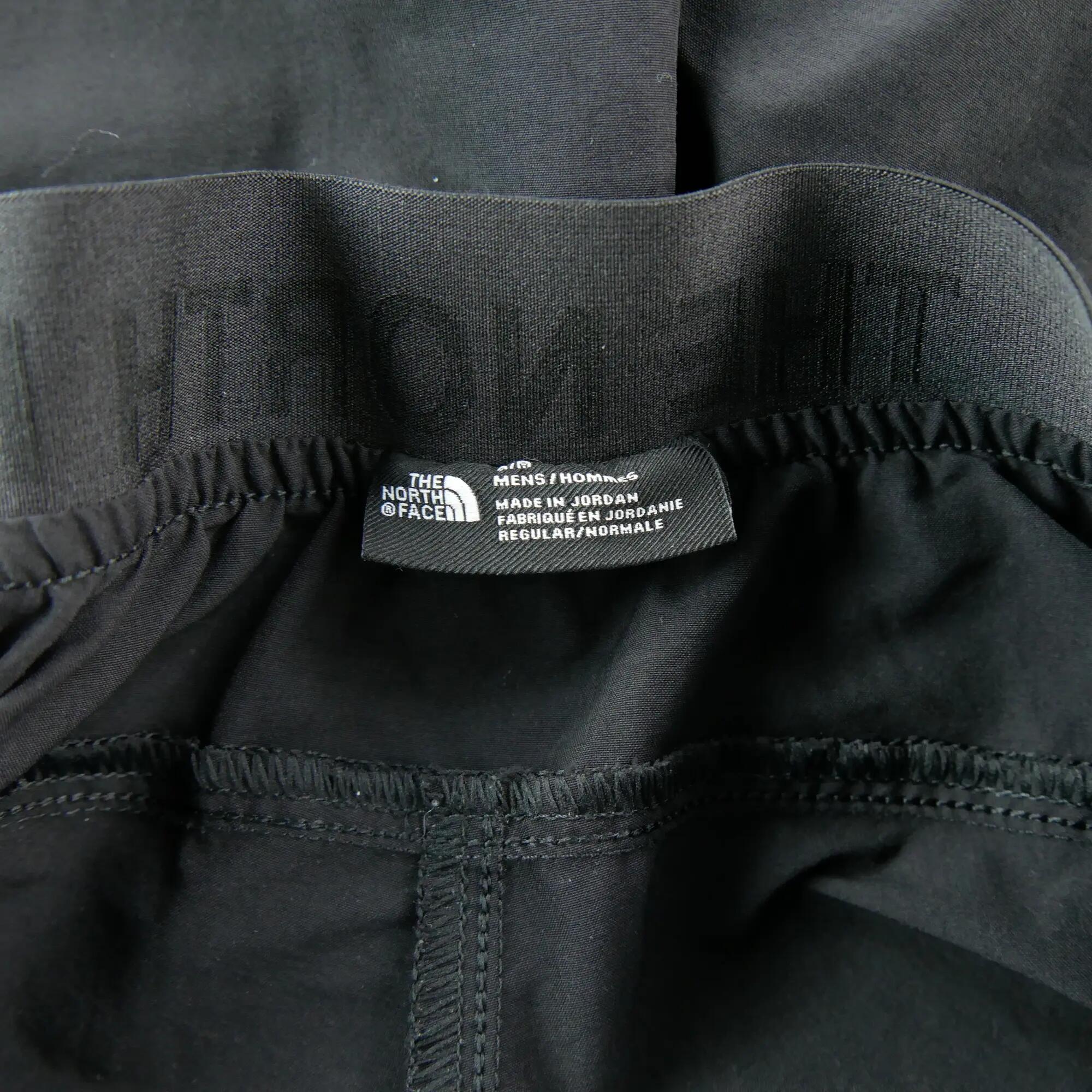 Tweedehands - Joggings heren The North Face running broek zwart - Als nieuw 6/7