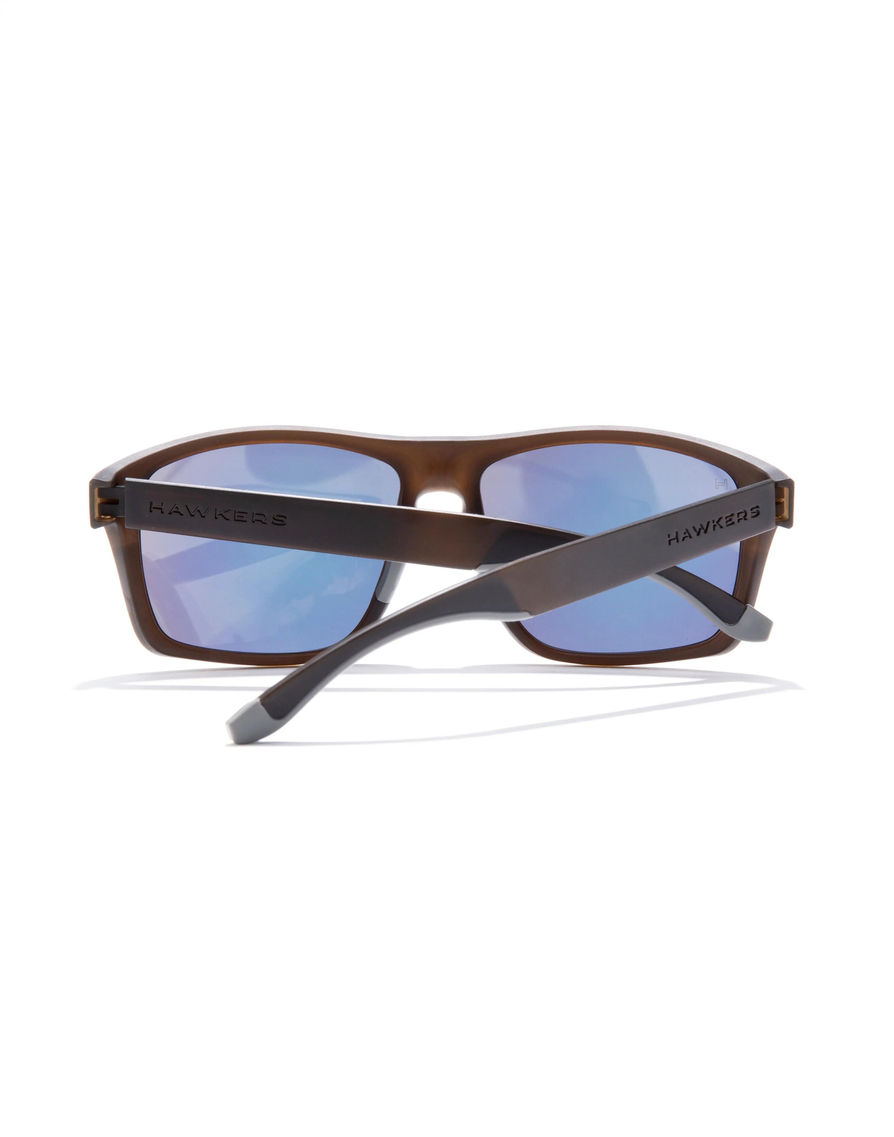 HAWKERS - Occhiali da Sole per Uomo e Donna FASTER SPORT RAW - TERRA BROWN ACID 5/6