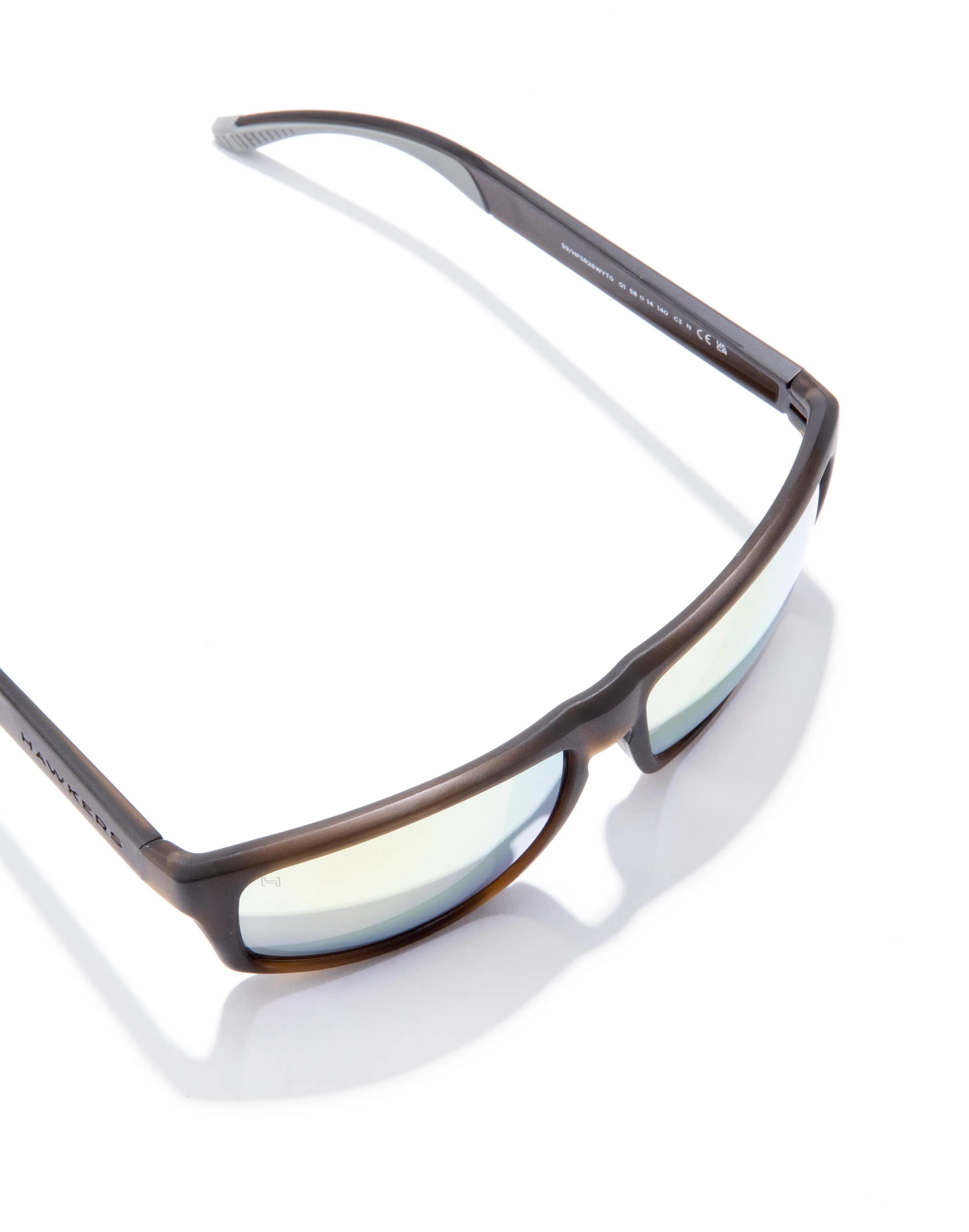 HAWKERS - Occhiali da Sole per Uomo e Donna FASTER SPORT RAW - TERRA BROWN ACID 4/6