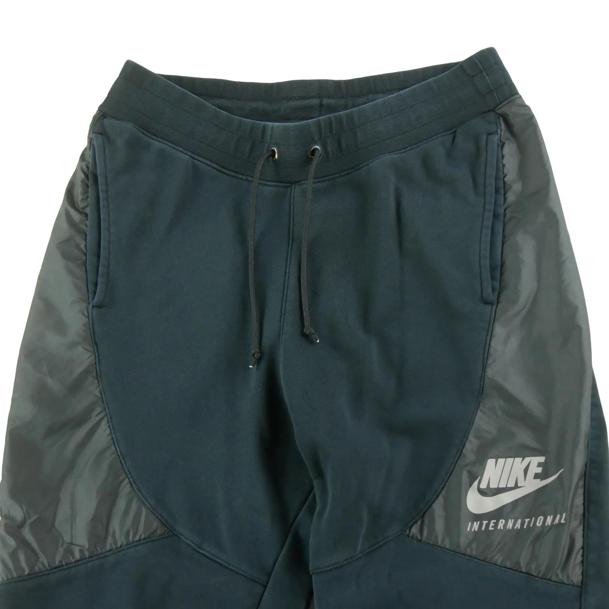 Second life - Spodnie dresowe męskie Nike INTL Pant hybrydowe - Stan dobry 5/7