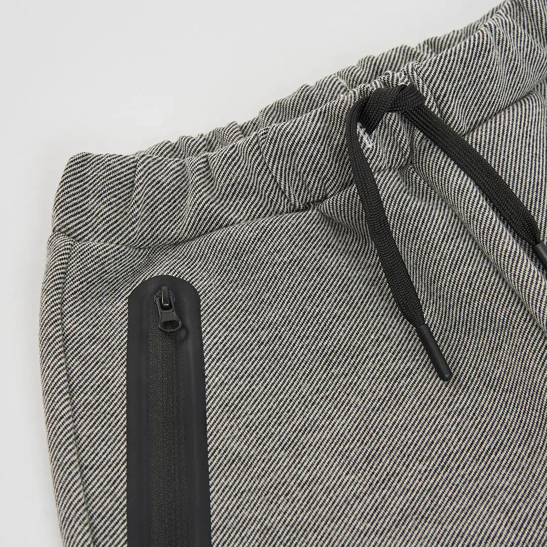 Pantalón punto negro niño con bolsillos cremallera 3/4