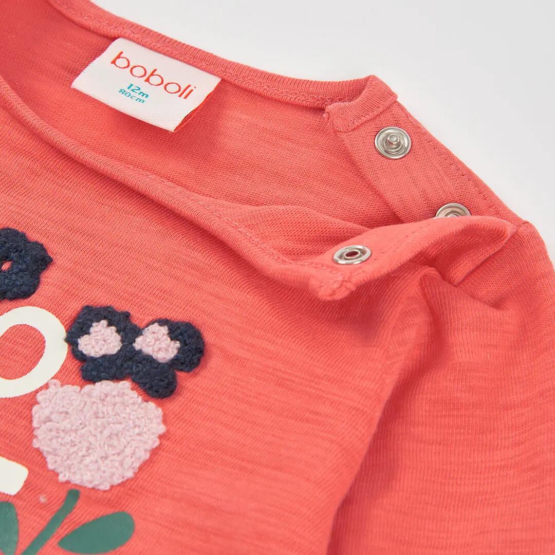 Camiseta niña naranja estampado flores 3/4