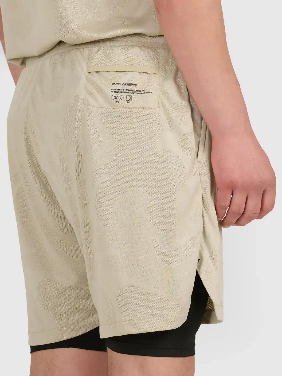 Szorty treningowe 2 w 1 z wykończeniem szybkoschnącym męskie beżowe 4F 2XL 4/7
