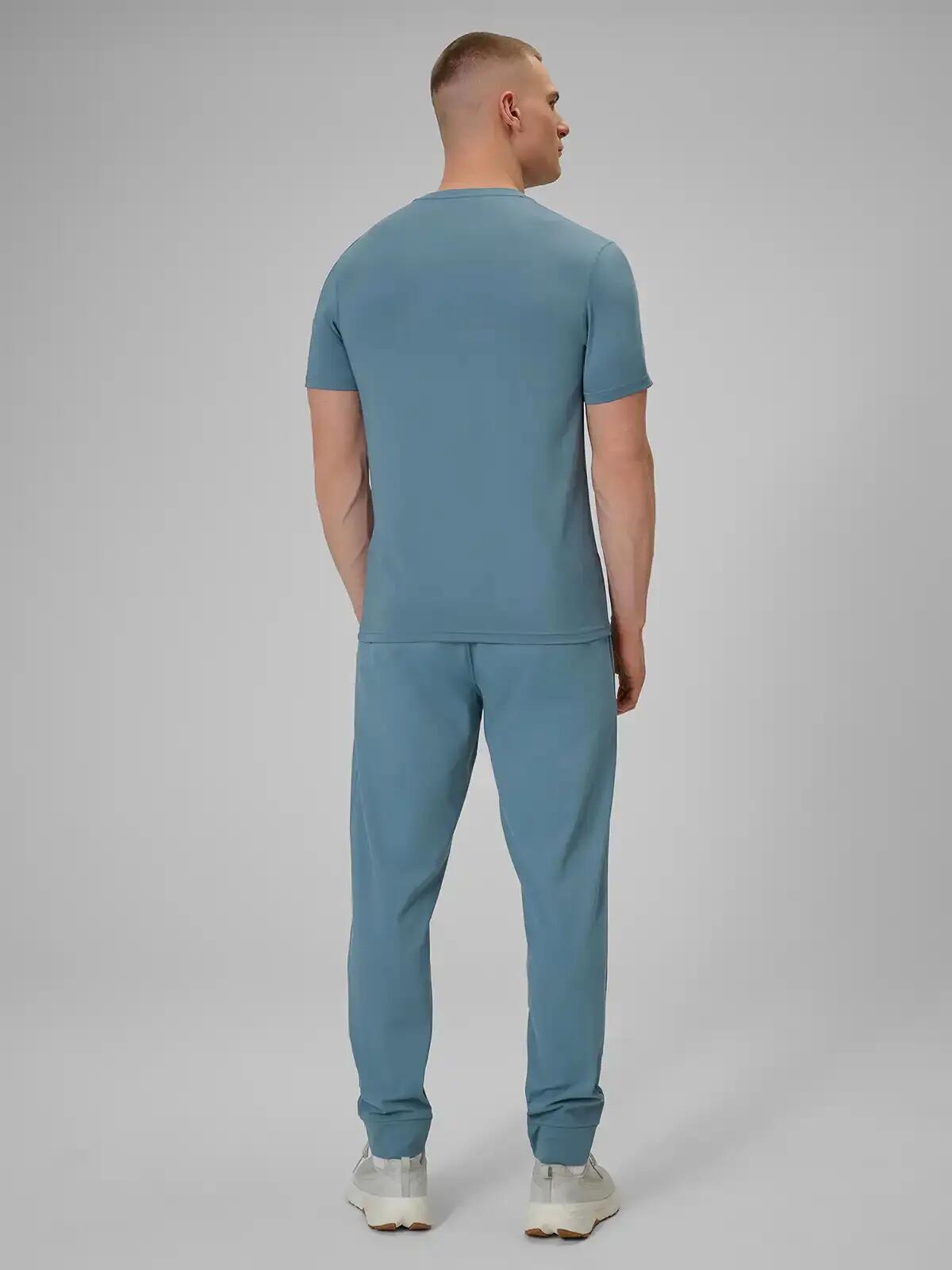 Spodnie treningowe z jednostronnie drapanej dzianiny męskie niebieskie 4F 2XL 3/7