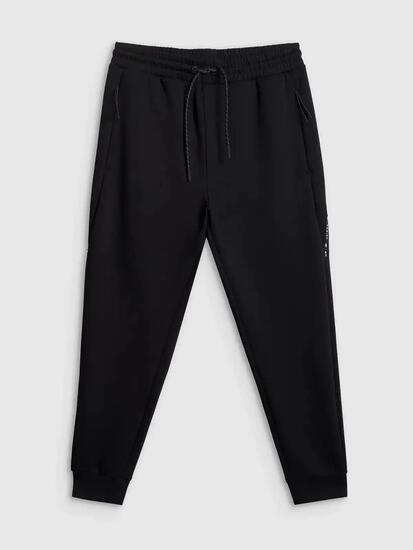 Spodnie treningowe joggery z technicznego materiału męskie czarne 4F Czarny XL