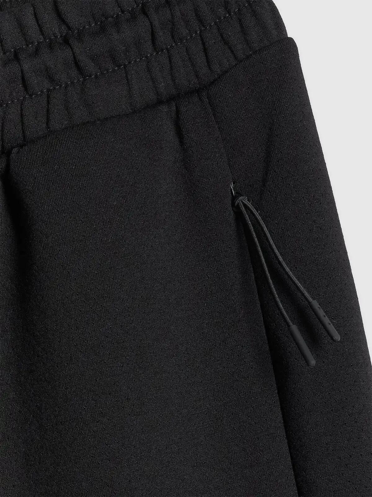 Spodnie treningowe joggery z technicznego materiału męskie czarne 4F Czarny XL 5/5