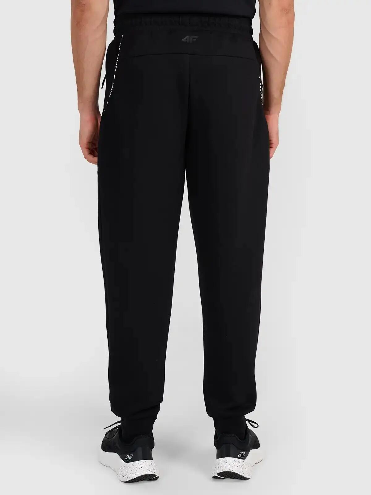 Spodnie treningowe joggery z technicznego materiału męskie czarne 4F Czarny XL 3/5