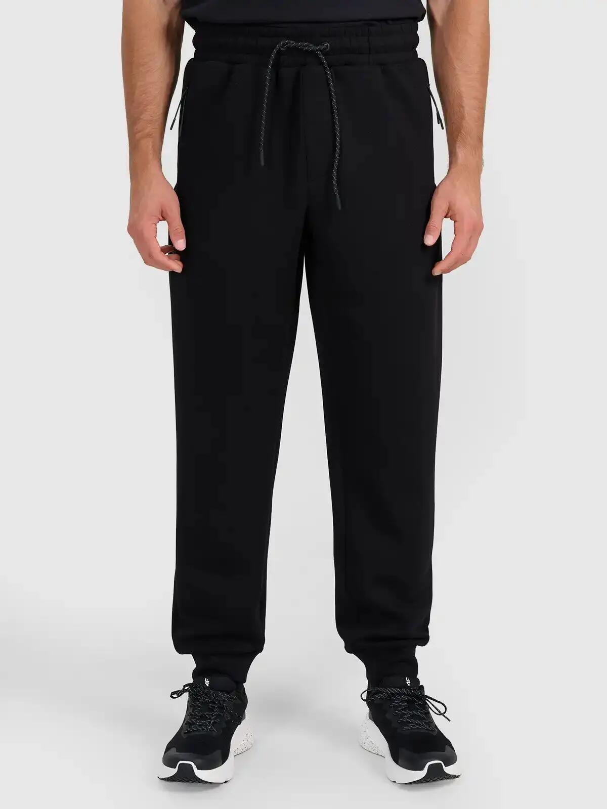 Spodnie treningowe joggery z technicznego materiału męskie czarne 4F Czarny XL 2/5