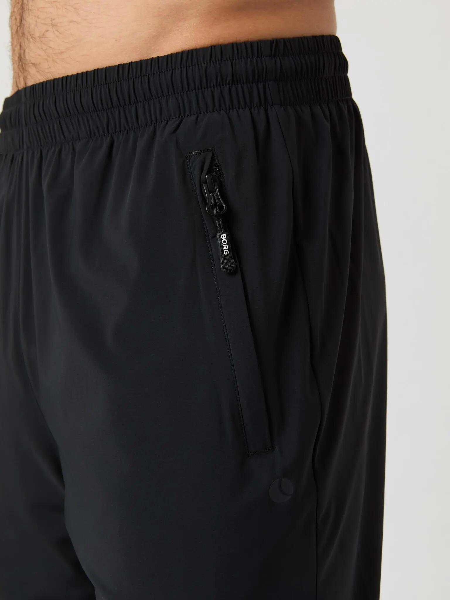 bjorn_borg ACE TRACK PANTS en BLACK BEAUTY pour MEN 3/4