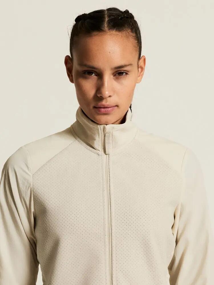 craft Fleece Jersey Jacket W — Jaqueta running quente com mangas corta‑vento 6/7