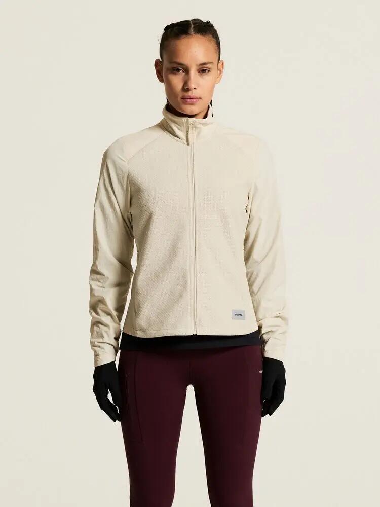 craft Fleece Jersey Jacket W — Jaqueta running quente com mangas corta‑vento 5/7