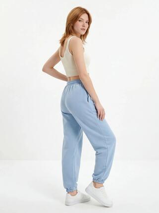Damskie spodnie dresowe oversize UNLEASH WINGS PASTEL BLUE
