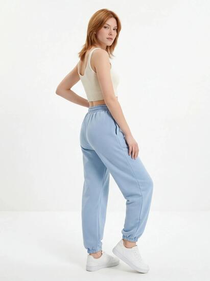 Damskie spodnie dresowe oversize UNLEASH WINGS PASTEL BLUE