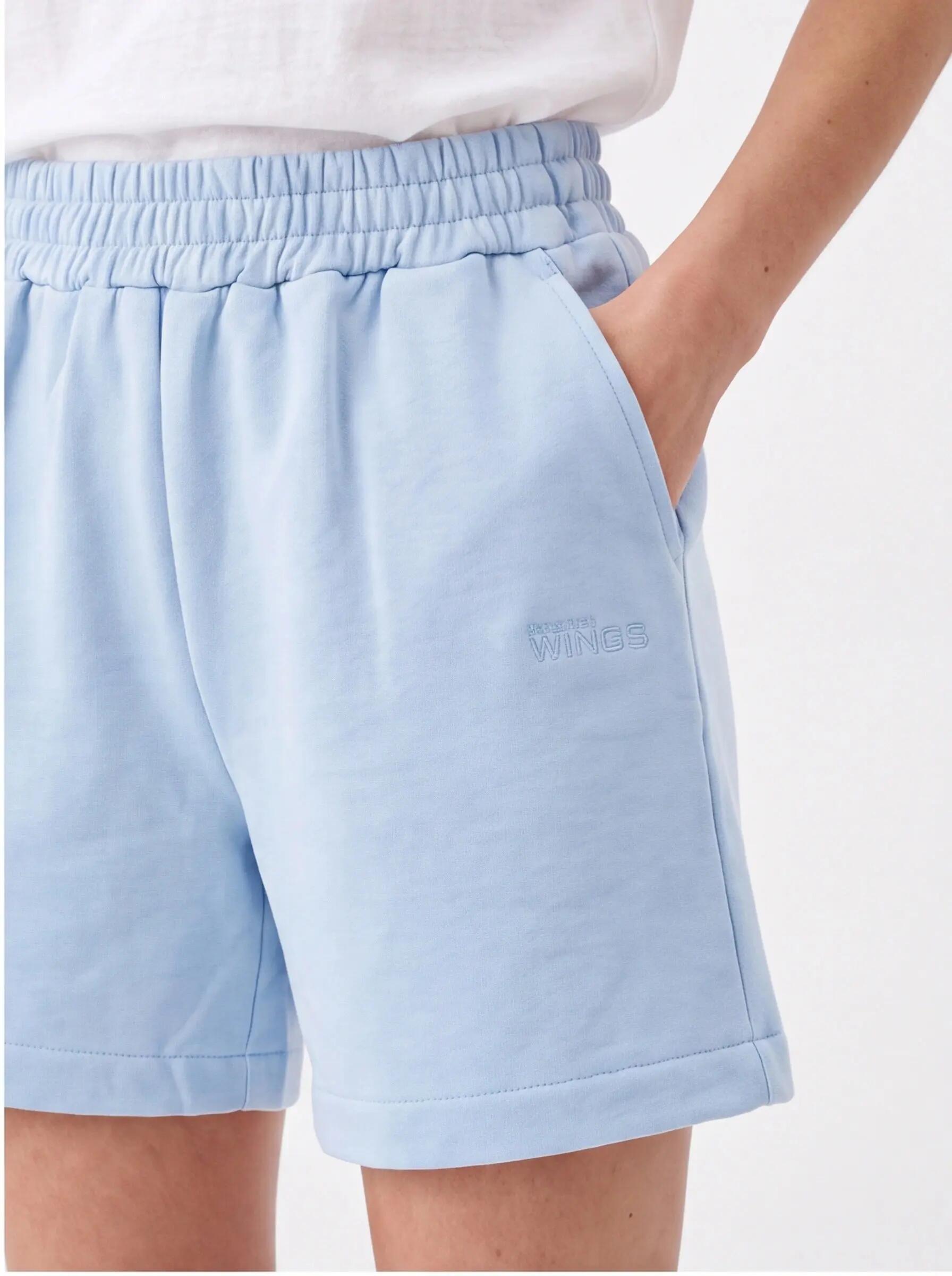 Shorts de sport pour femmes UNLEASH WINGS BLEU PASTEL 2/3