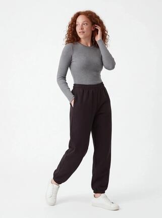 Damskie spodnie dresowe oversize UNLEASH WINGS BLACK