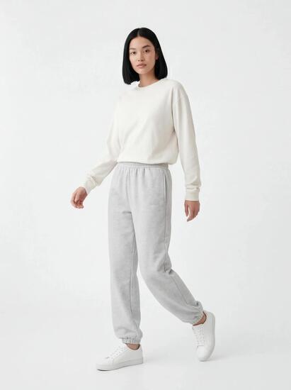 Damskie spodnie dresowe oversize UNLEASH WINGS GREY