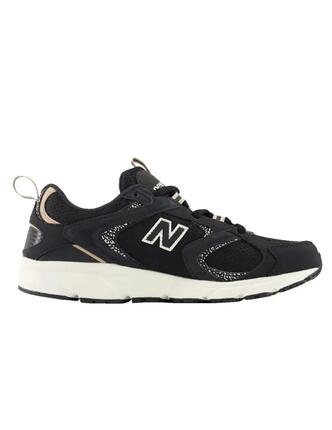 Chaussures de femme New Balance noires.
