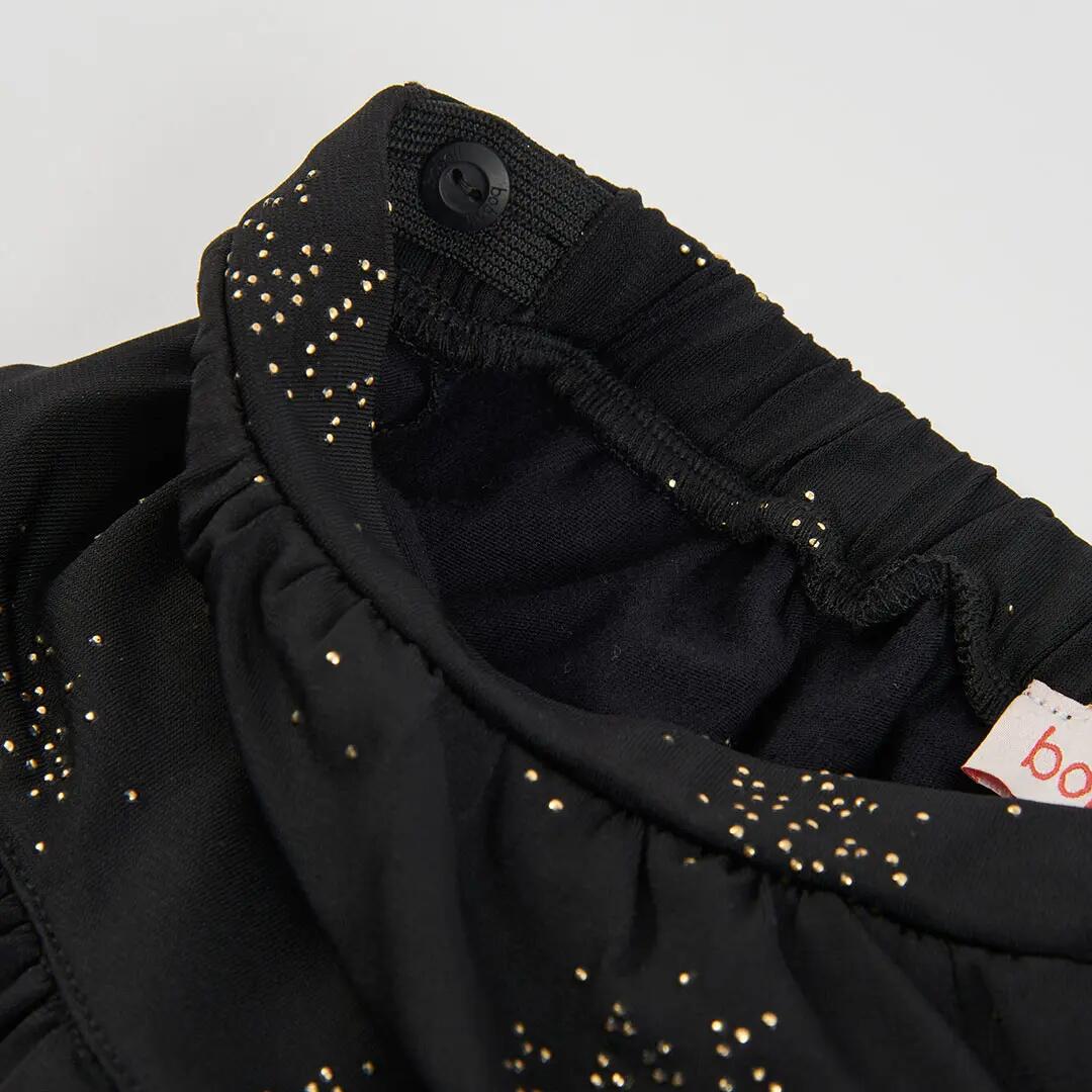 Falda punto negra estampada con estrellas y volantes 3/4