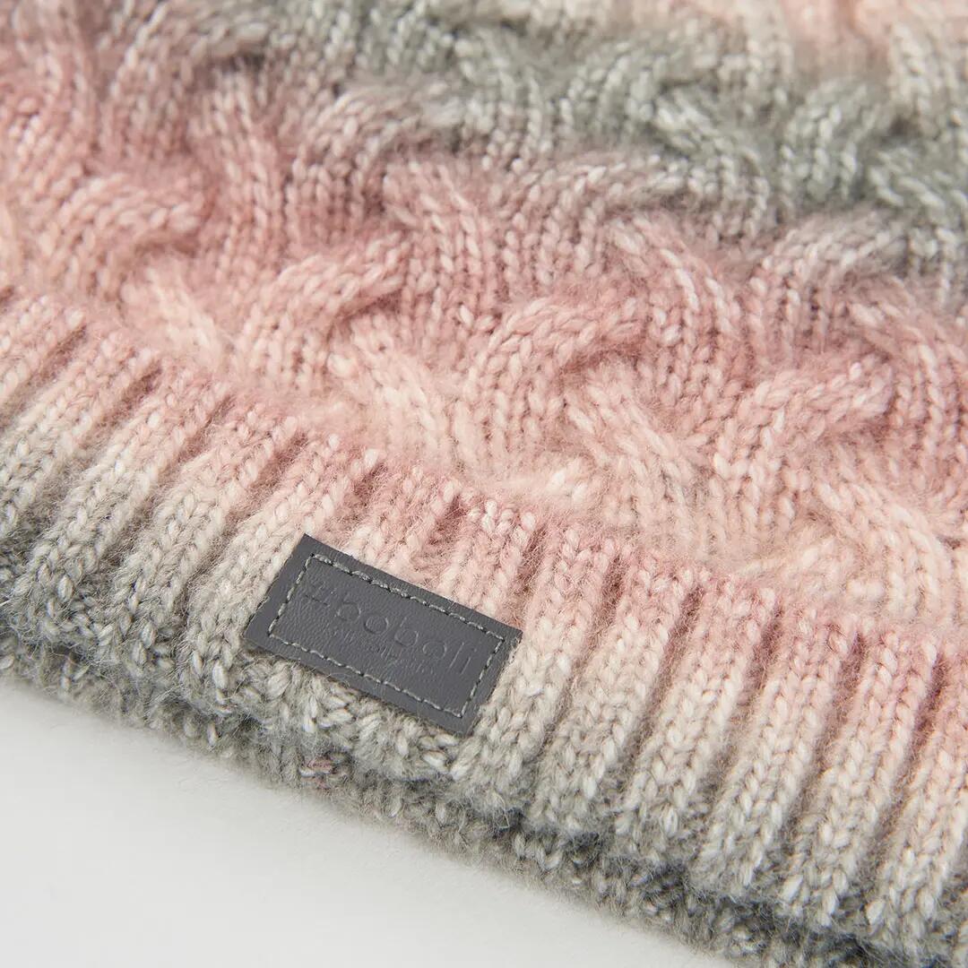 Gorro rosa trenzado con pompón 2/3